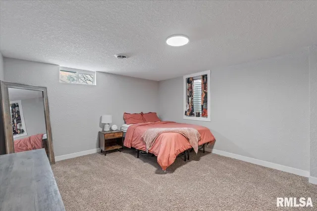 a view of swimming pool with outdoor seating and plants