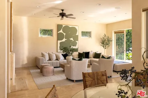 a view of a house with pool porch and chairs