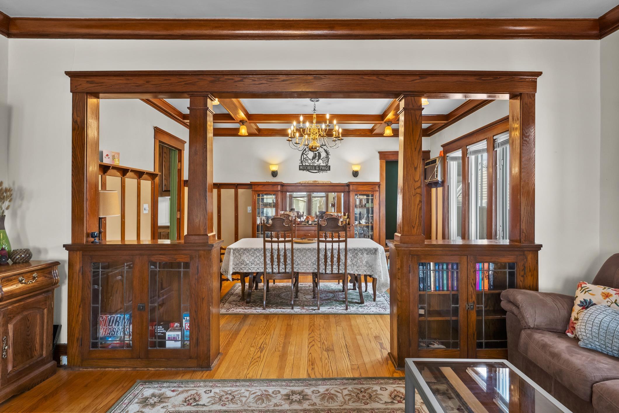 1617 Madison Street Manitowoc, WI 54220 - Photo 5 of 34 Built-in book cases/storage, columns, wood floors...just lovely.