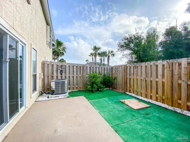 a view of a backyard with sitting area