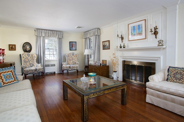 41 Sheldon Road Newton, MA 02459 - Photo 2 of 7 a living room with furniture and a fireplace