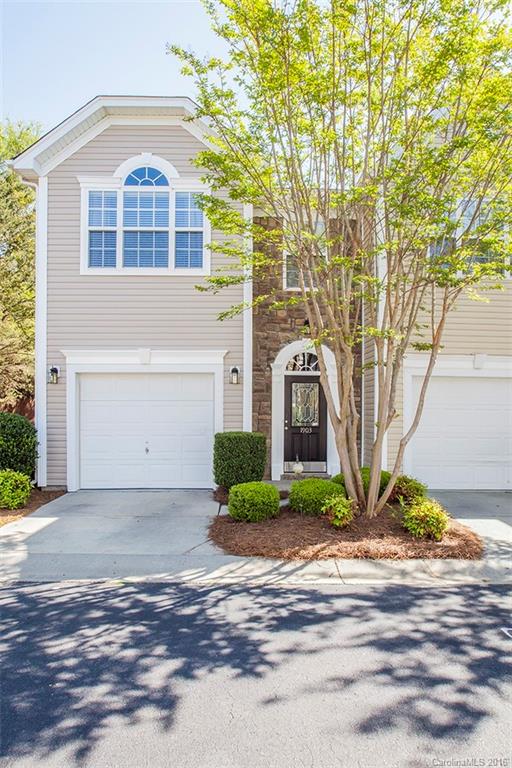 1903 Travertine Lane, Unit 1903 Fort Mill, SC 29708 - Photo 1 of 16 a front view of a house with garden