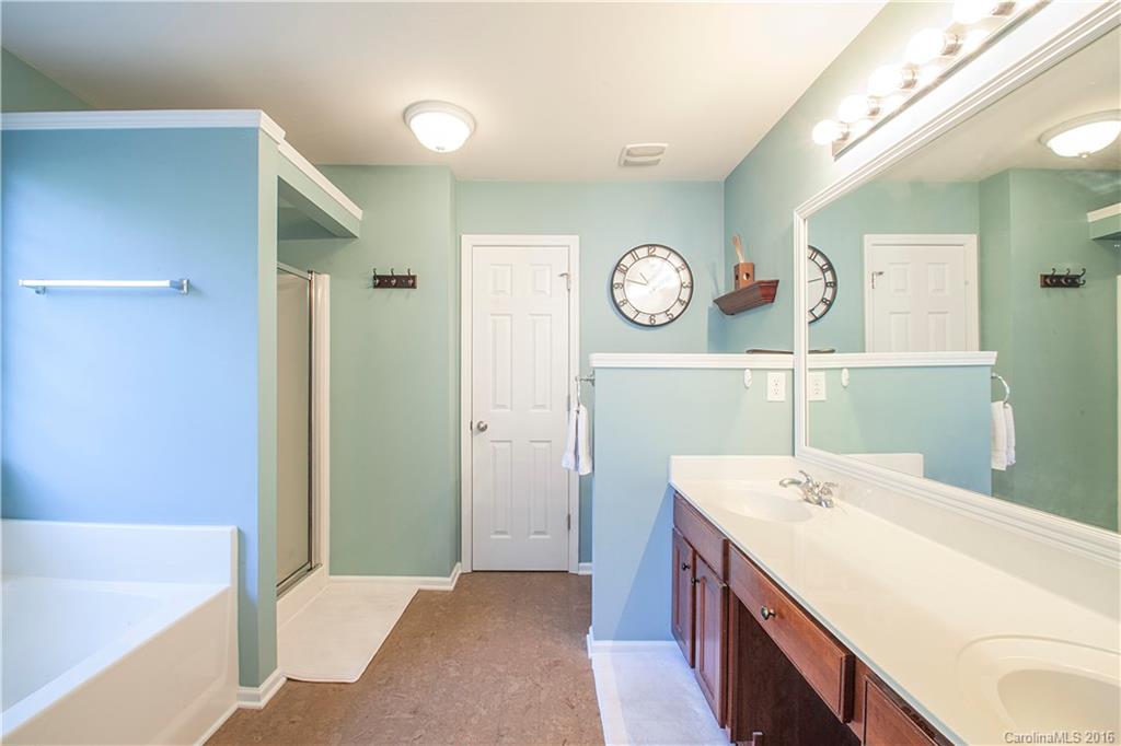 1903 Travertine Lane, Unit 1903 Fort Mill, SC 29708 - Photo 11 of 16 a room with a clock and a view of bathroom