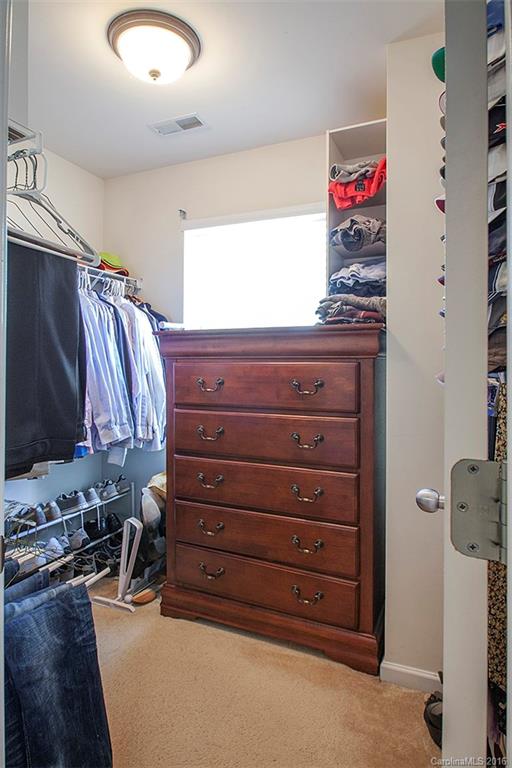 1903 Travertine Lane, Unit 1903 Fort Mill, SC 29708 - Photo 12 of 16 a view of walk in closet with clothes and shoes