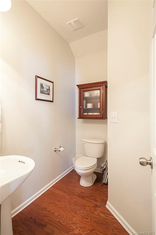 1903 Travertine Lane, Unit 1903 Fort Mill, SC 29708 - Photo 7 of 16 a bathroom with a toilet a sink and a mirror