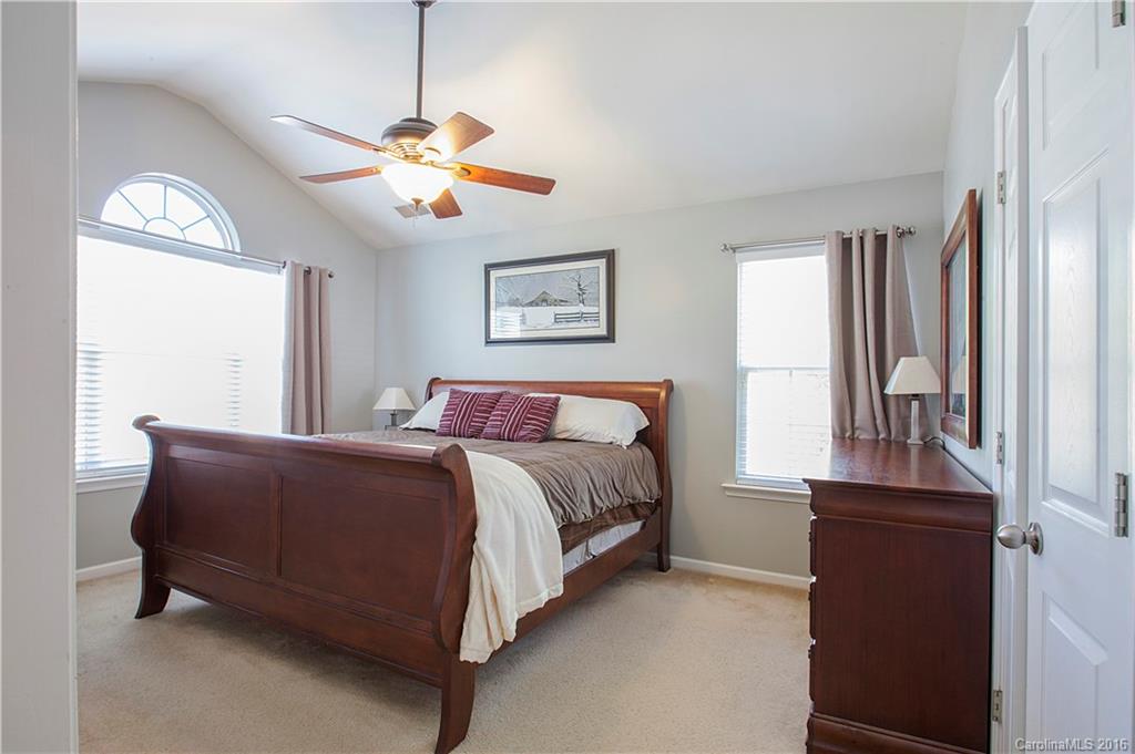1903 Travertine Lane, Unit 1903 Fort Mill, SC 29708 - Photo 8 of 16 a bedroom with a bed and a window