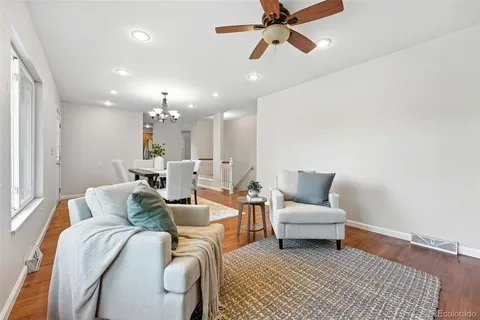 a living room with furniture and a rug