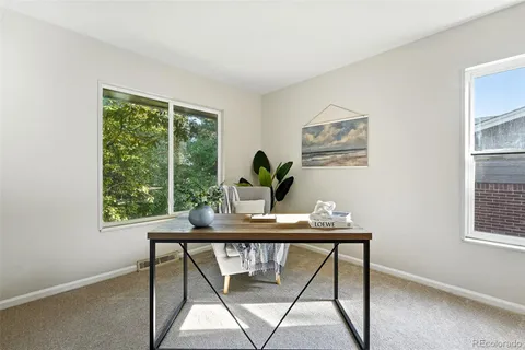 a view of a dining room with furniture window and outside view