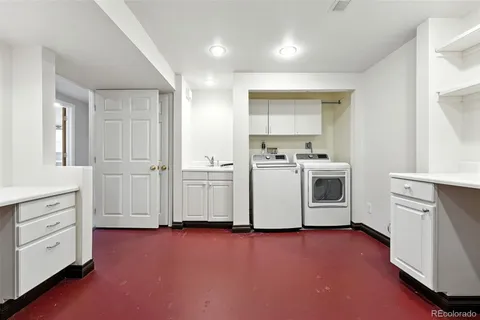 a view of a kitchen with washer and dryer
