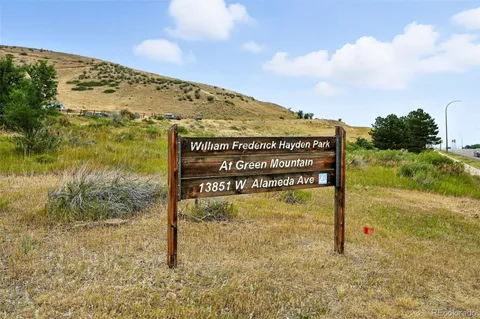 a park view with a bench in the background