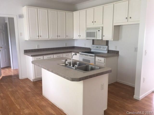 1903 Tom Williams Road Monroe, NC 28112 - Photo 7 of 22 a kitchen with stainless steel appliances granite countertop a sink stove and cabinets