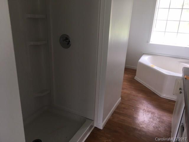 1903 Tom Williams Road Monroe, NC 28112 - Photo 10 of 22 a view of a bathroom with a bathtub