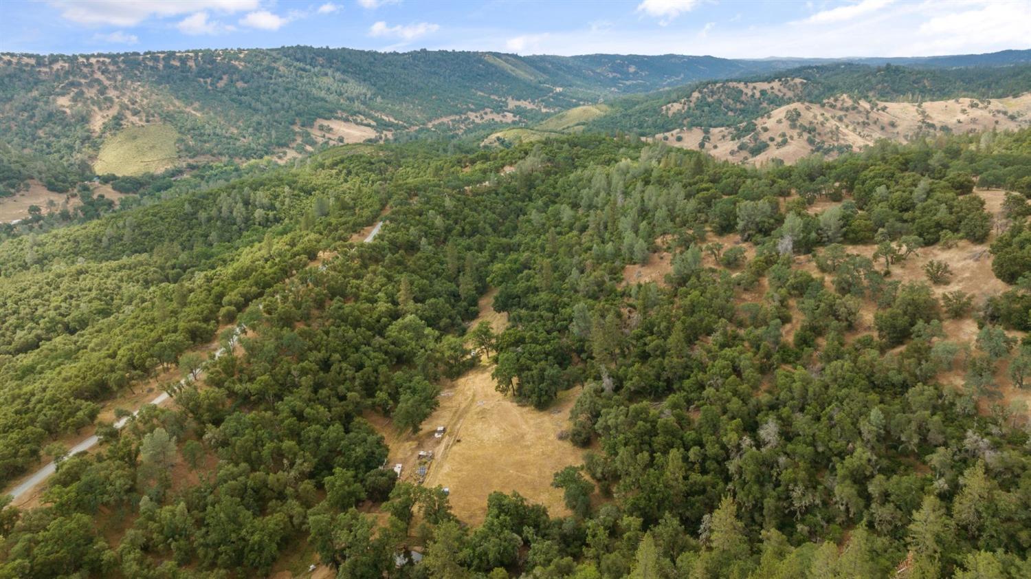 3 Bell Road Plymouth, CA 95669 - Photo 2 of 11 a view of a lake and green valley