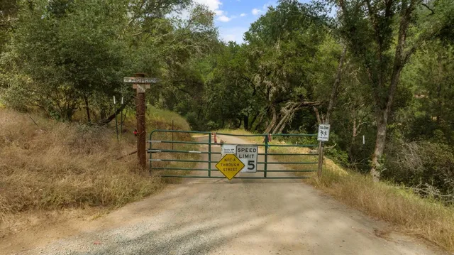 a view of a backyard of the house