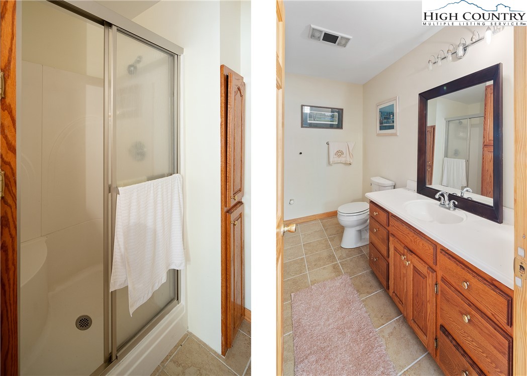 2161 Stone Mountain Road Vilas, NC 28692 - Photo 21 of 50 a spacious bathroom with a double vanity sink a mirror and a shower