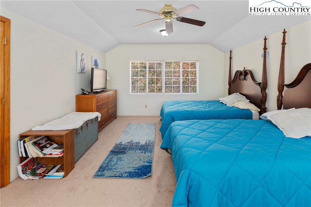 2161 Stone Mountain Road Vilas, NC 28692 - Photo 23 of 50 a bedroom with a bed and a large window