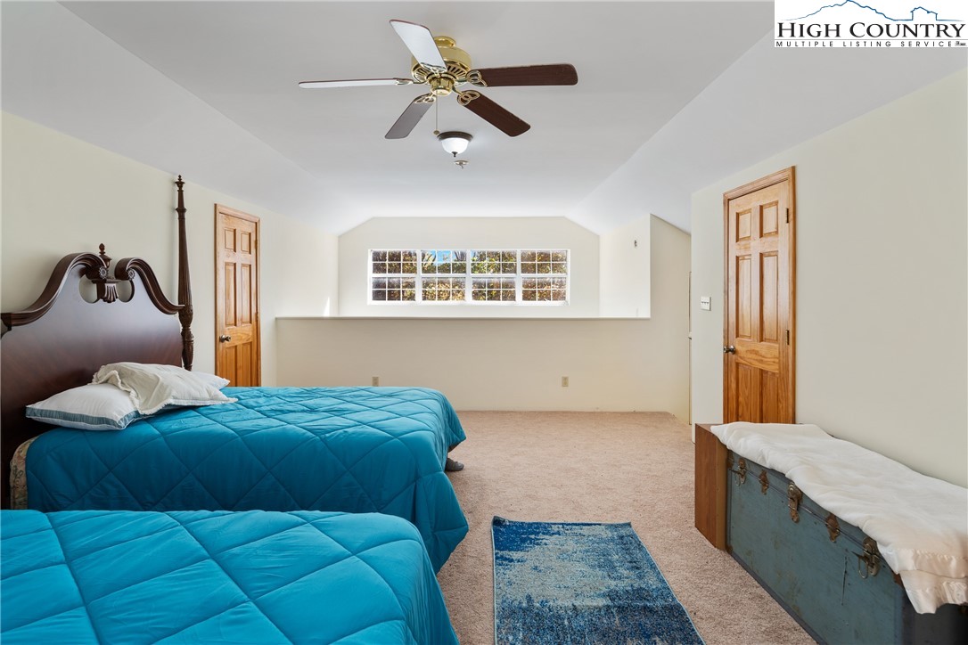 2161 Stone Mountain Road Vilas, NC 28692 - Photo 24 of 50 a bedroom with a bed and a dresser