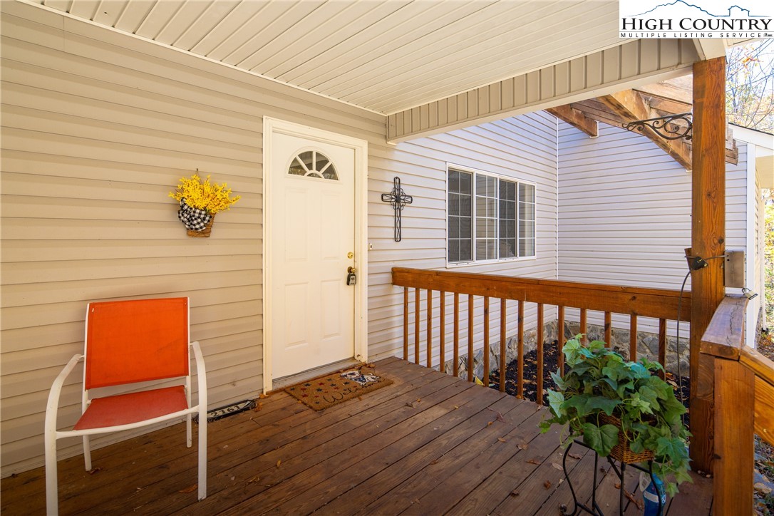 2161 Stone Mountain Road Vilas, NC 28692 - Photo 30 of 50 a front view of a house with wooden deck