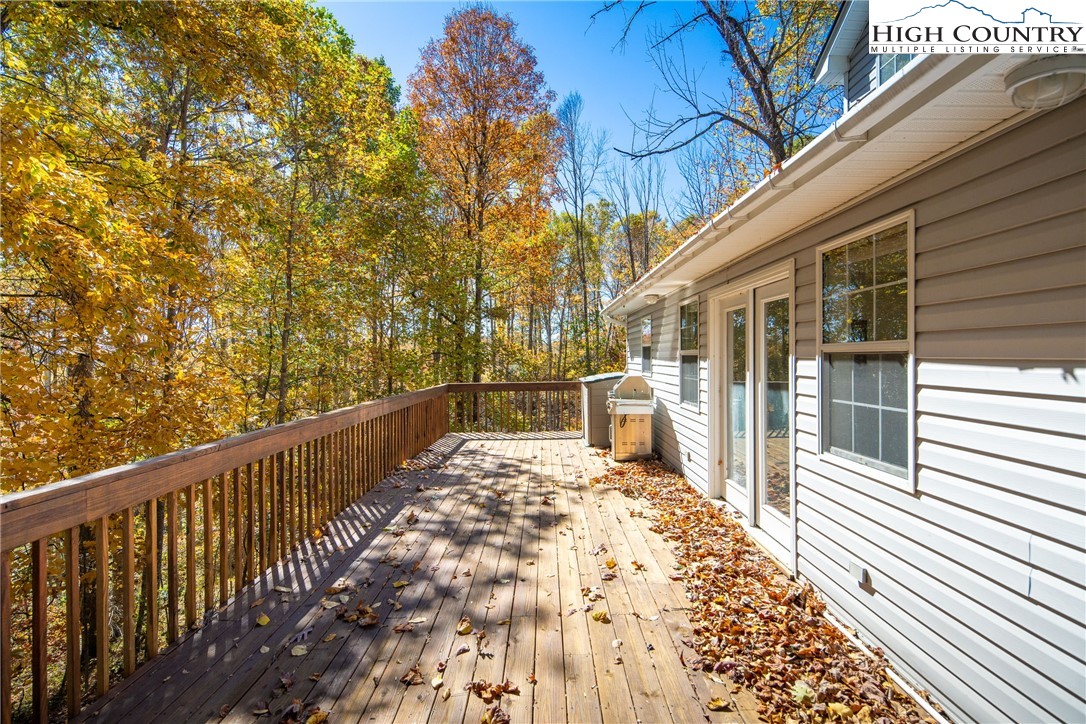 2161 Stone Mountain Road Vilas, NC 28692 - Photo 32 of 50 a view of a balcony with wooden floor and fence