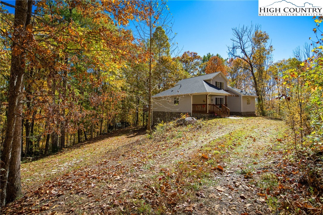 2161 Stone Mountain Road Vilas, NC 28692 - Photo 34 of 50 a front view of a house with a yard