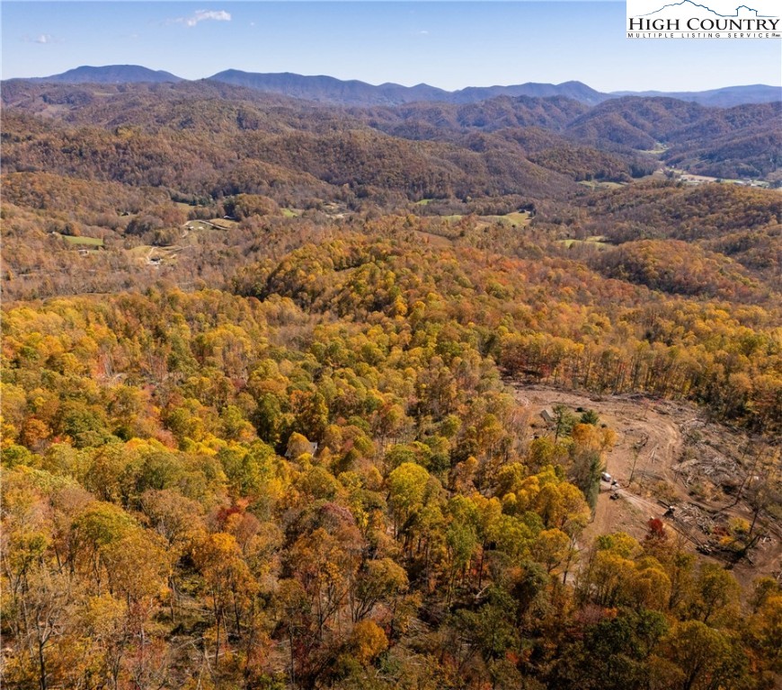 2161 Stone Mountain Road Vilas, NC 28692 - Photo 37 of 50 a view of a lush green hillside and houses