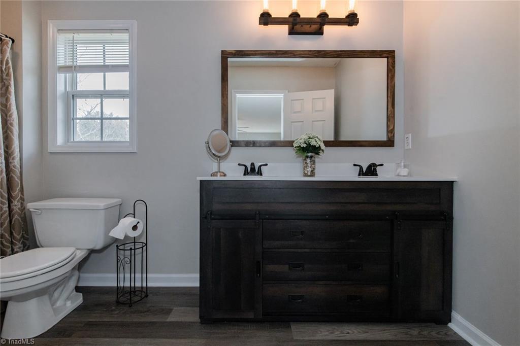 105 Stapleton Way High Point, NC 27265 - Photo 16 of 22 Master bath with updated vinyl flooring and vanity and lights