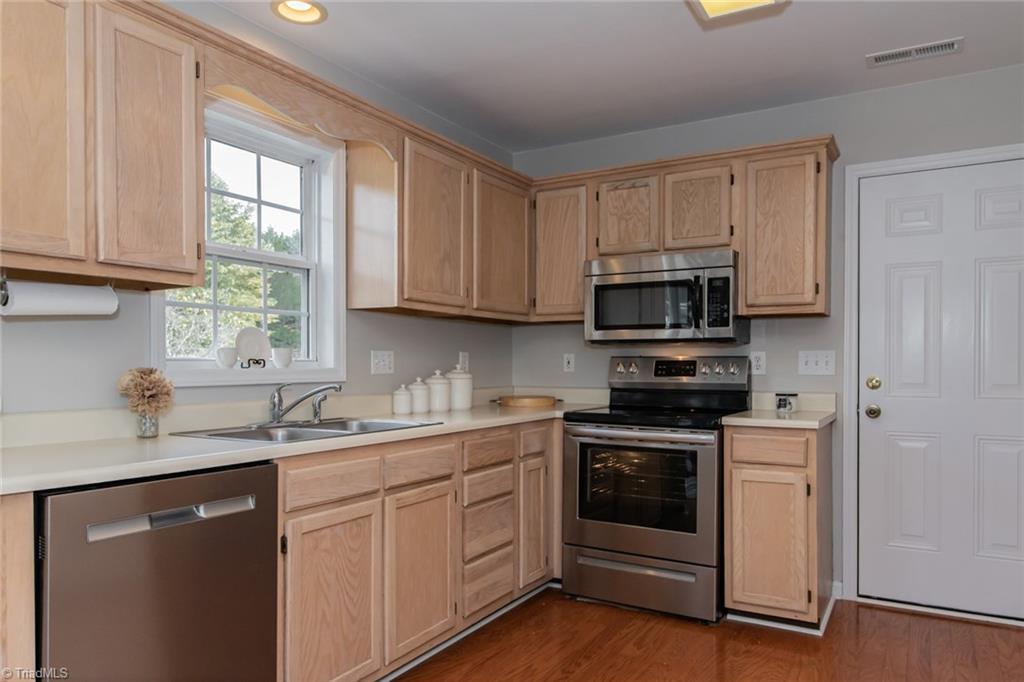 105 Stapleton Way High Point, NC 27265 - Photo 6 of 22 Kitchen with stainless steel dishwasher and oven range