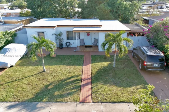 a house view with a garden space