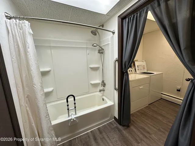 a bathroom with a sink a mirror and a bathtub
