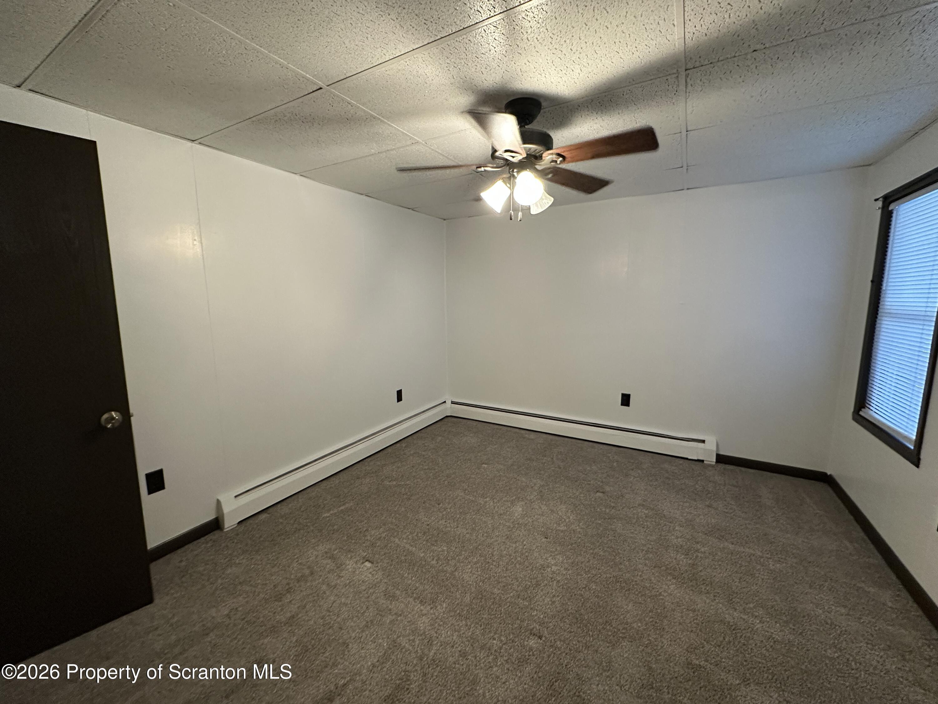 548 Main Street, Unit REAR Dickson City, PA 18519 - Photo 7 of 13 an empty room with a view of a bathroom