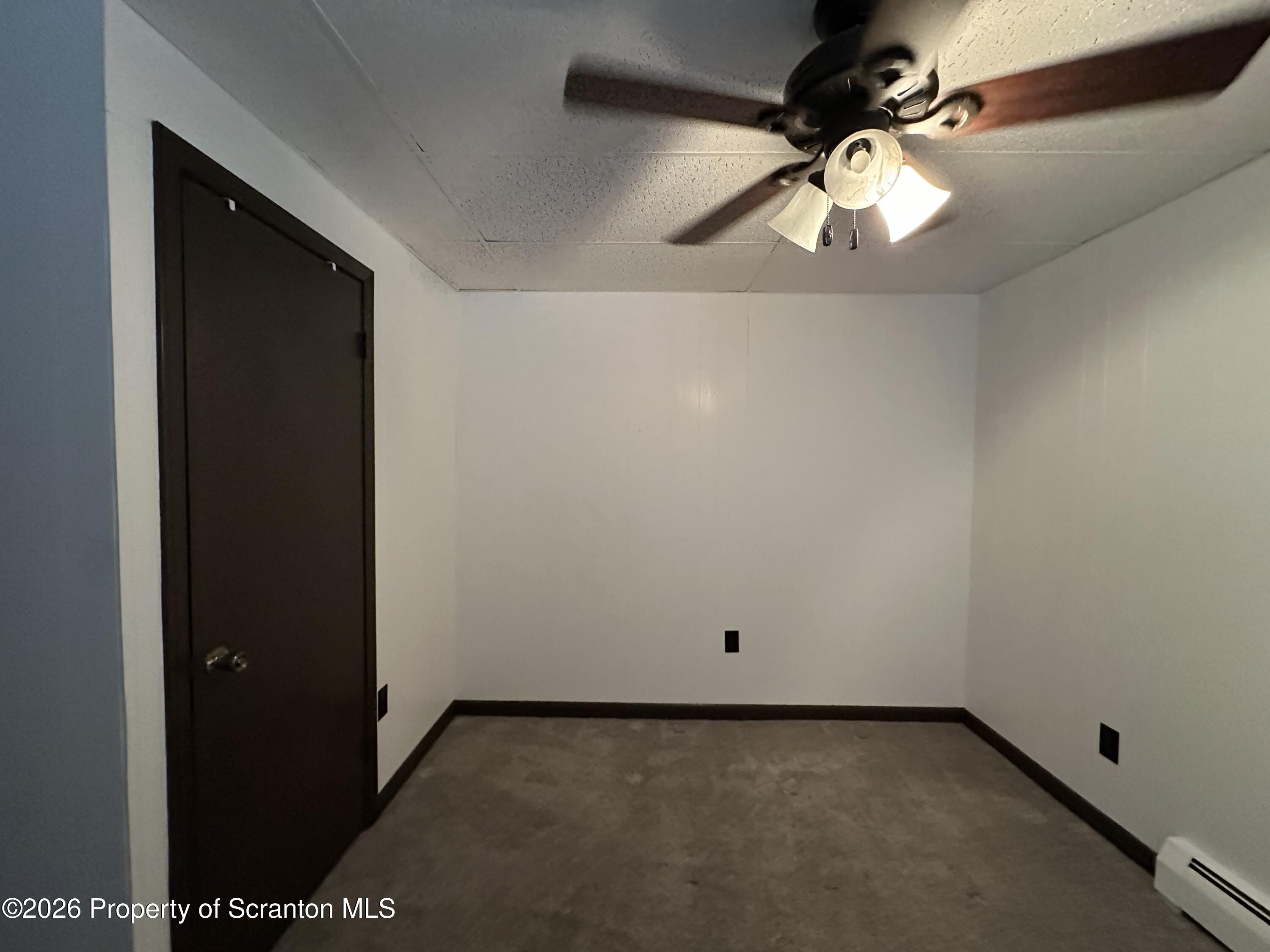 548 Main Street, Unit REAR Dickson City, PA 18519 - Photo 10 of 13 wooden floor in an empty room