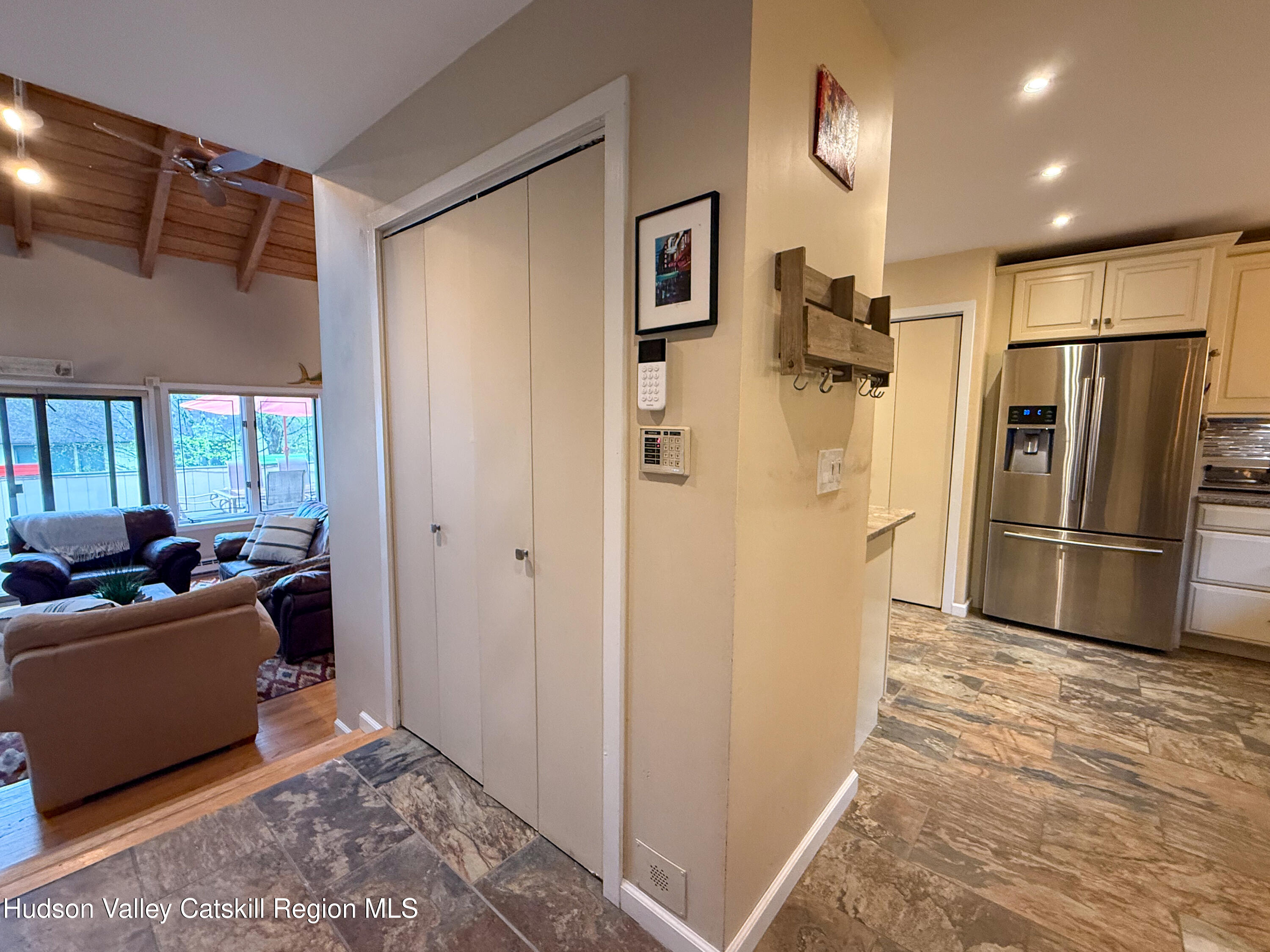 300 Pines Drive, Unit 446 Roxbury, NY 12421 - Photo 16 of 49 a view of a kitchen with a refrigerator and a couch
