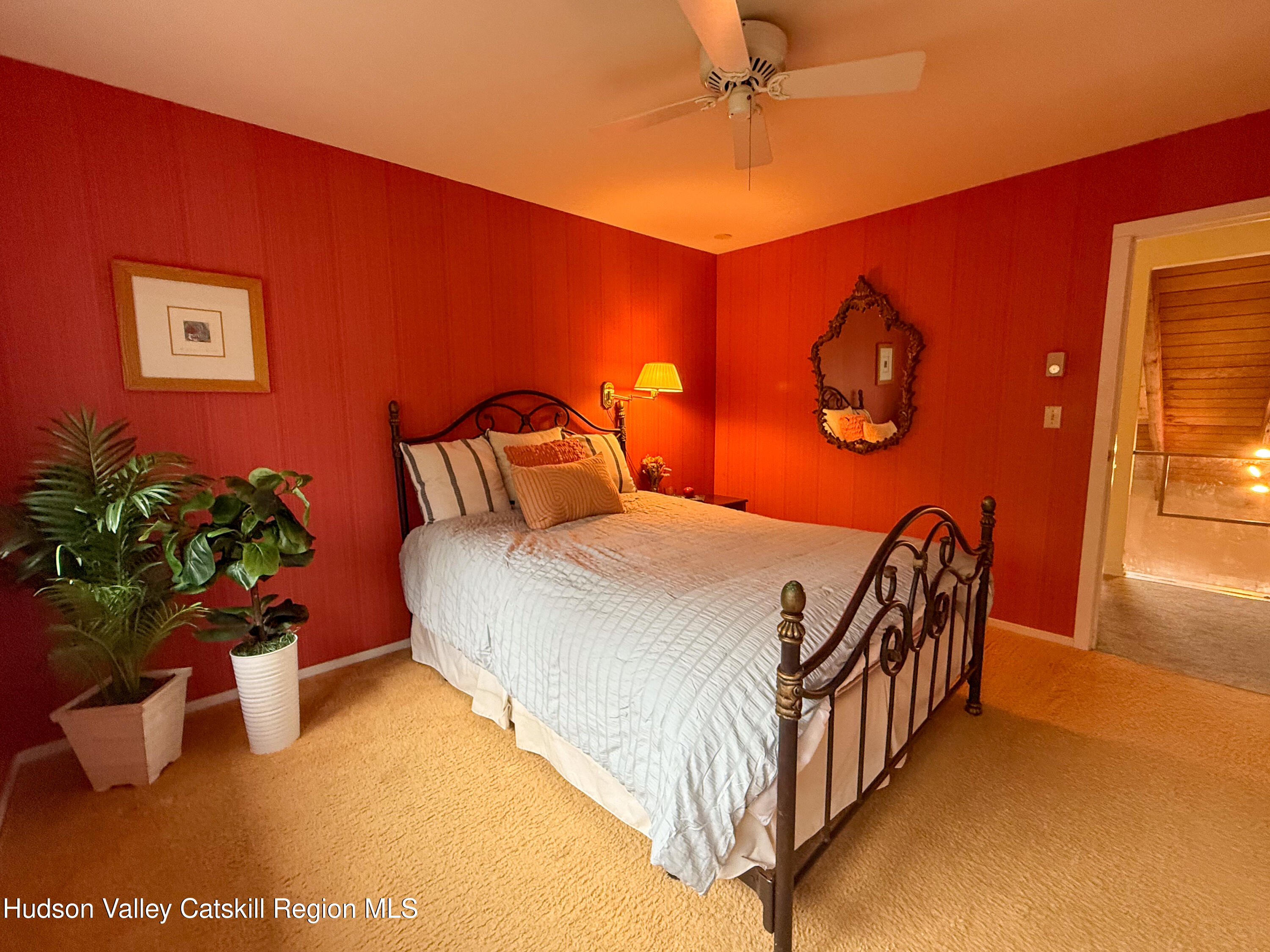 300 Pines Drive, Unit 446 Roxbury, NY 12421 - Photo 27 of 49 a bedroom with a bed and a potted plant