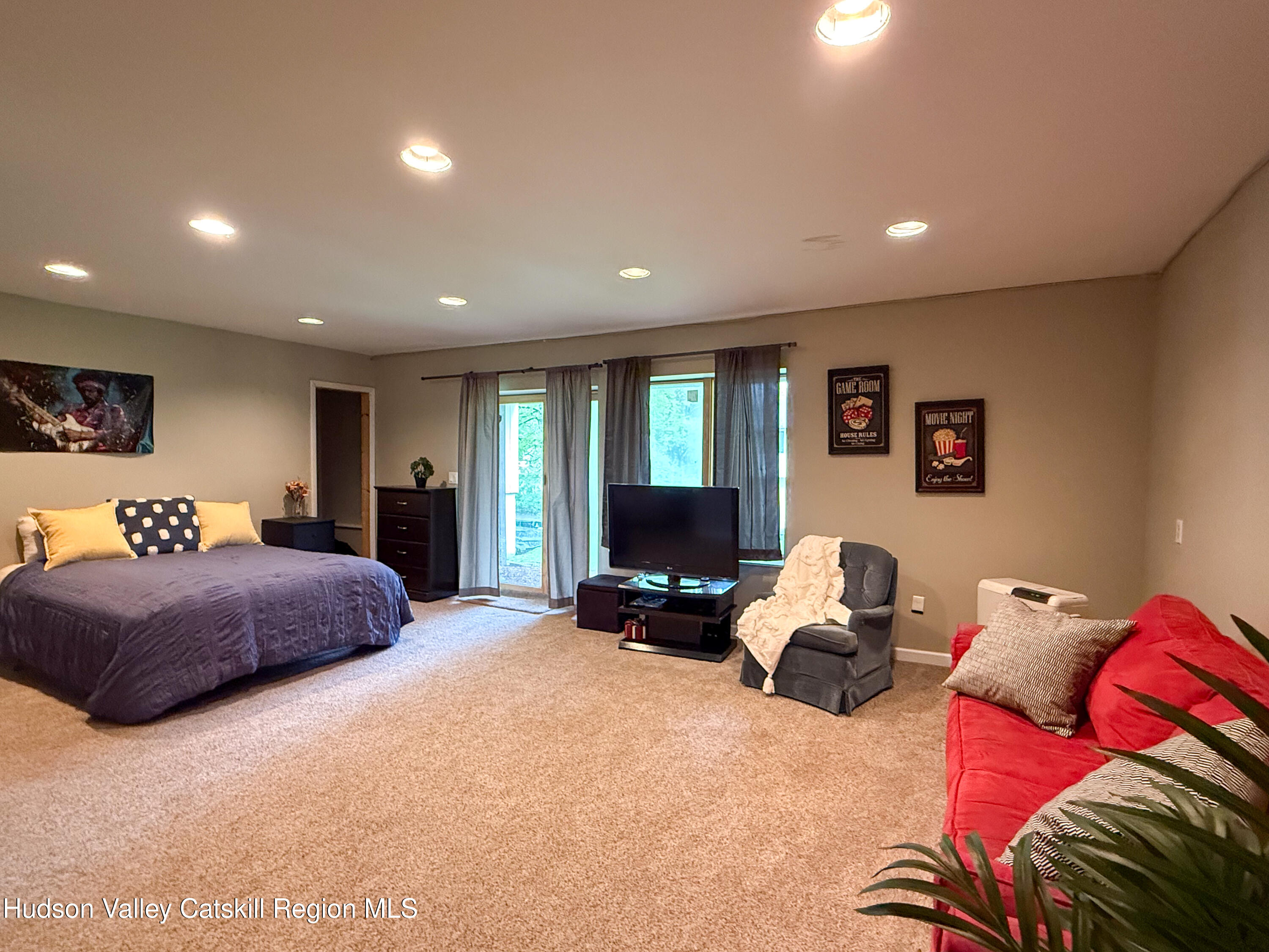 300 Pines Drive, Unit 446 Roxbury, NY 12421 - Photo 36 of 49 a bedroom with a bed and furniture