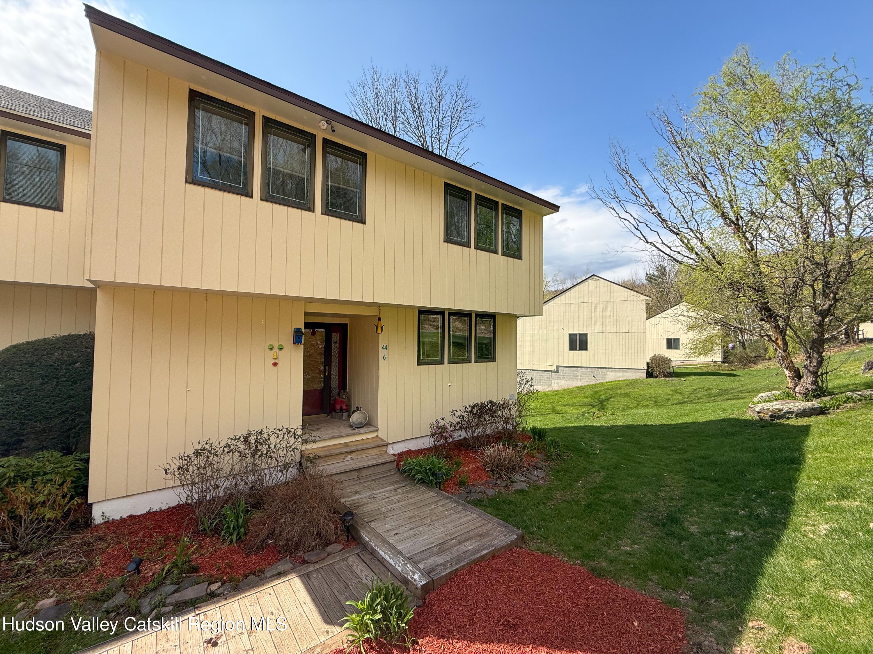 300 Pines Drive, Unit 446 Roxbury, NY 12421 - Photo 49 of 49 a front view of a house with garden