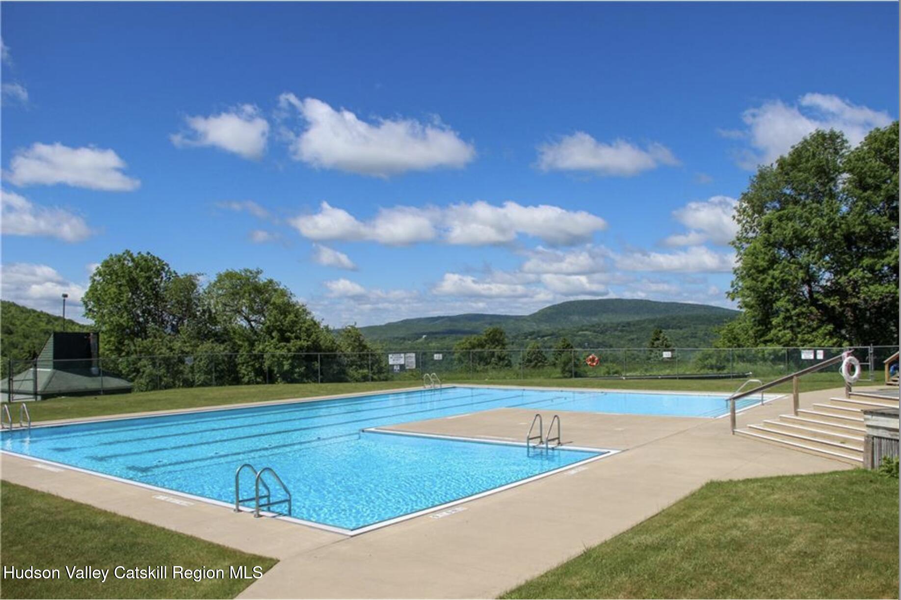300 Pines Drive, Unit 446 Roxbury, NY 12421 - Photo 8 of 49 a view of an outdoor space and tennis court