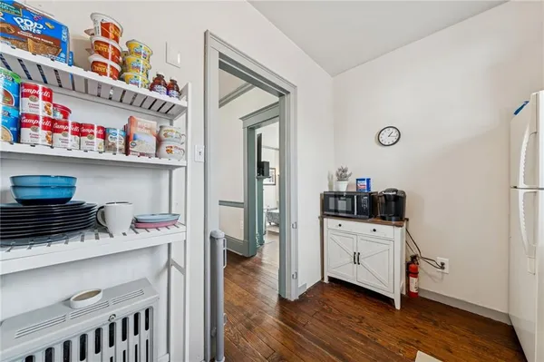 a kitchen with a cabinets and wooden floor