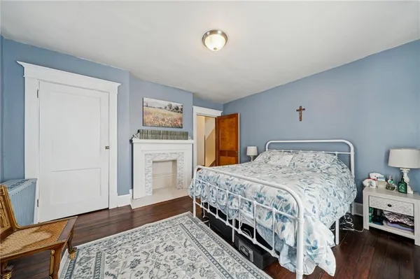 a bedroom with a bed and a dresser