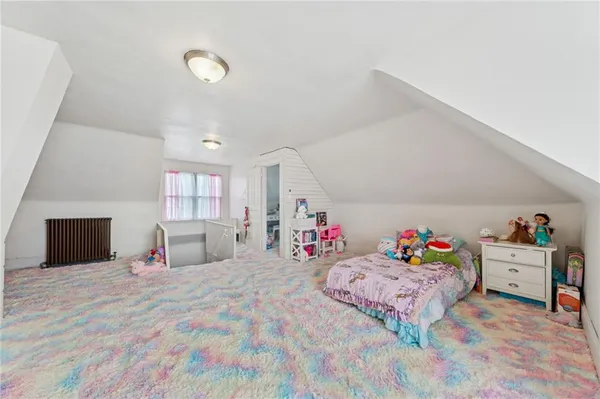 a bed room with a bed and a desk