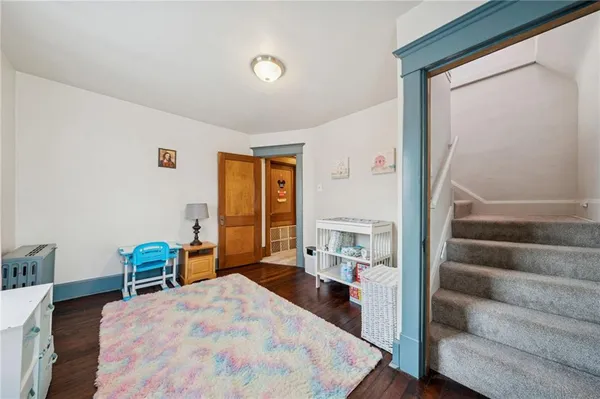 a bedroom with a bed and a view of bedroom