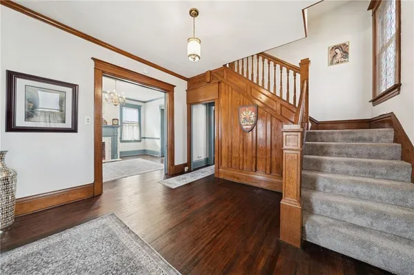 a view of an entryway with wooden floor
