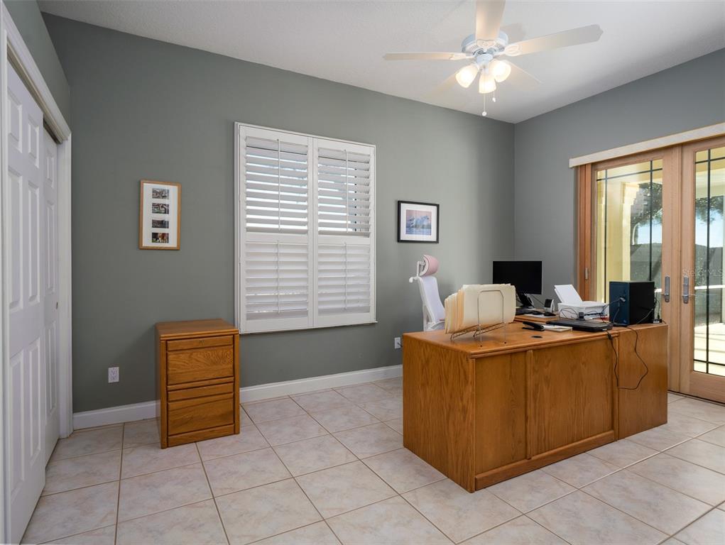 2185 Northwest 114th Loop Ocala, FL 34475 - Photo 9 of 25 a living room with a couch and a window
