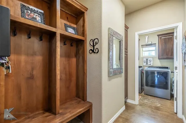 a view of an entryway with wooden floor