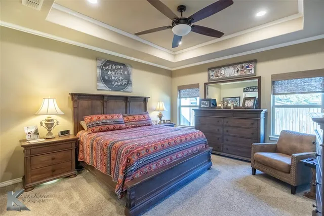 a bedroom with a bed and a couch