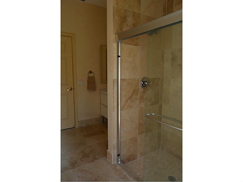 12656 Tucano Circle Boca Raton, FL 33428 - Photo 12 of 12 a bathroom with a shower and a sink