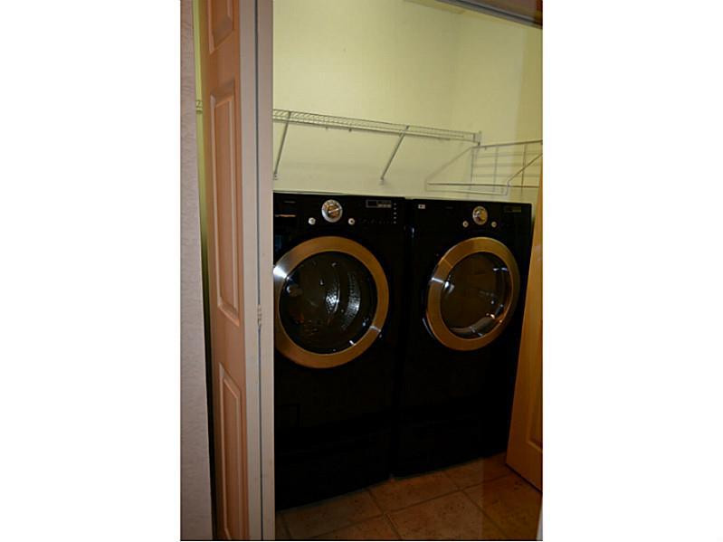 12656 Tucano Circle Boca Raton, FL 33428 - Photo 3 of 12 a utility room with dryer and washer