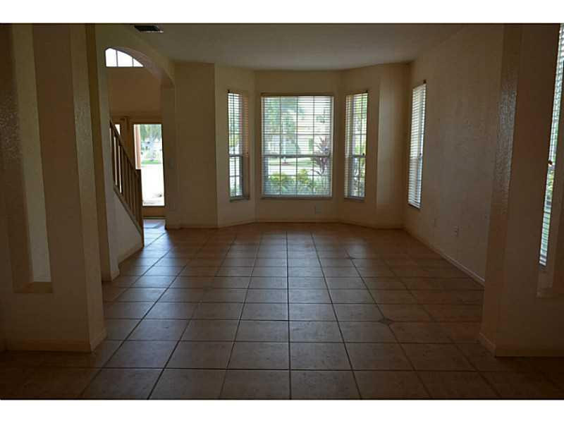 12656 Tucano Circle Boca Raton, FL 33428 - Photo 9 of 12 a view of an empty room with window and bathroom