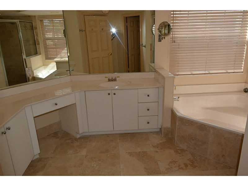 12656 Tucano Circle Boca Raton, FL 33428 - Photo 10 of 12 a bathroom with a double vanity sink and mirror