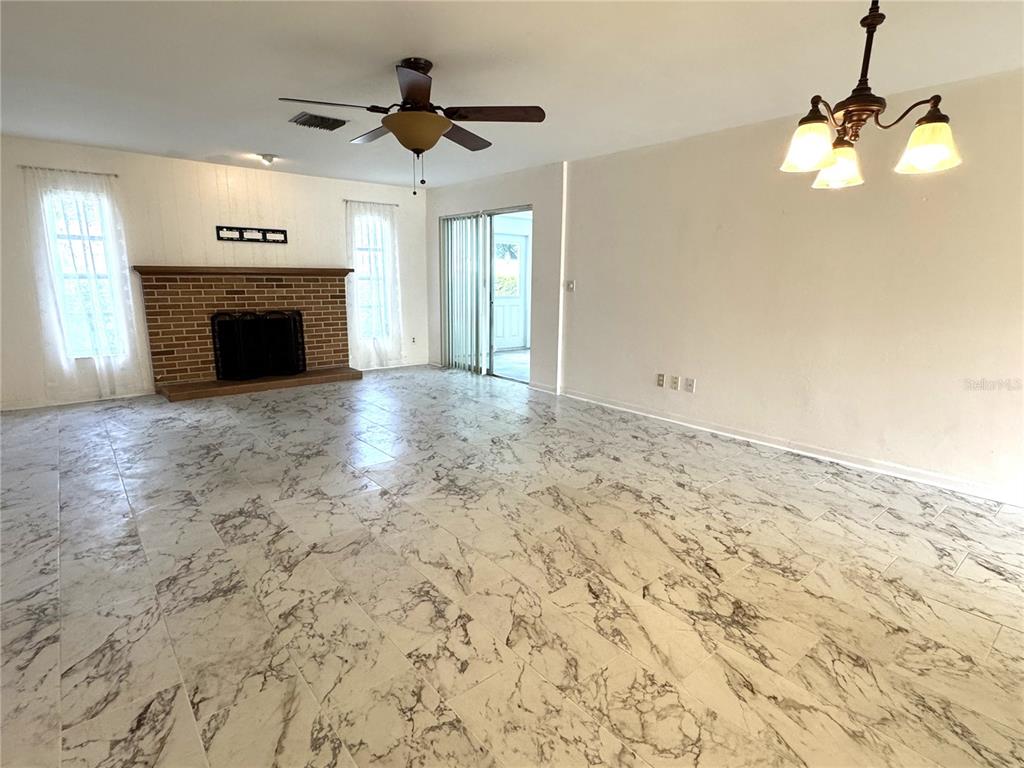 610 Indian Rocks Road North, Unit 103 Belleair Bluffs, FL 33770 - Photo 7 of 13 a view of empty room with fireplace