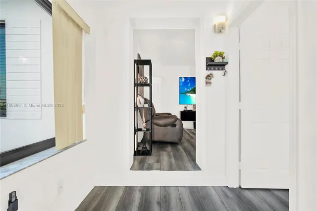 a view of living room with furniture and rug